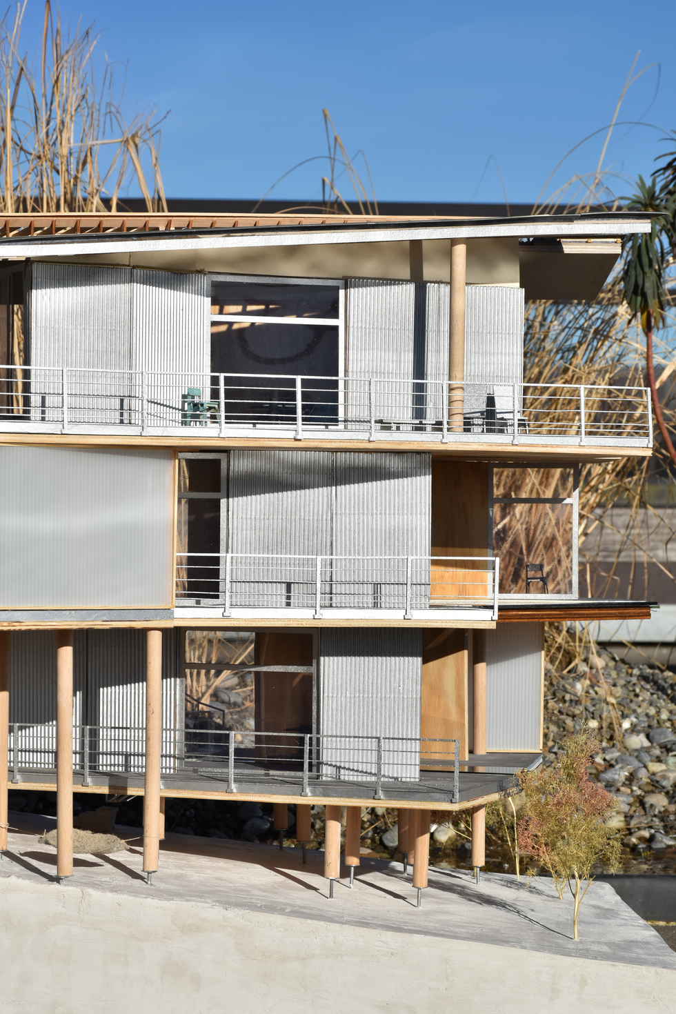 Prefabricated wood architectural model, illustrating a contemporary building designed through algorithmic processes, creating dynamic and informal living spaces.
