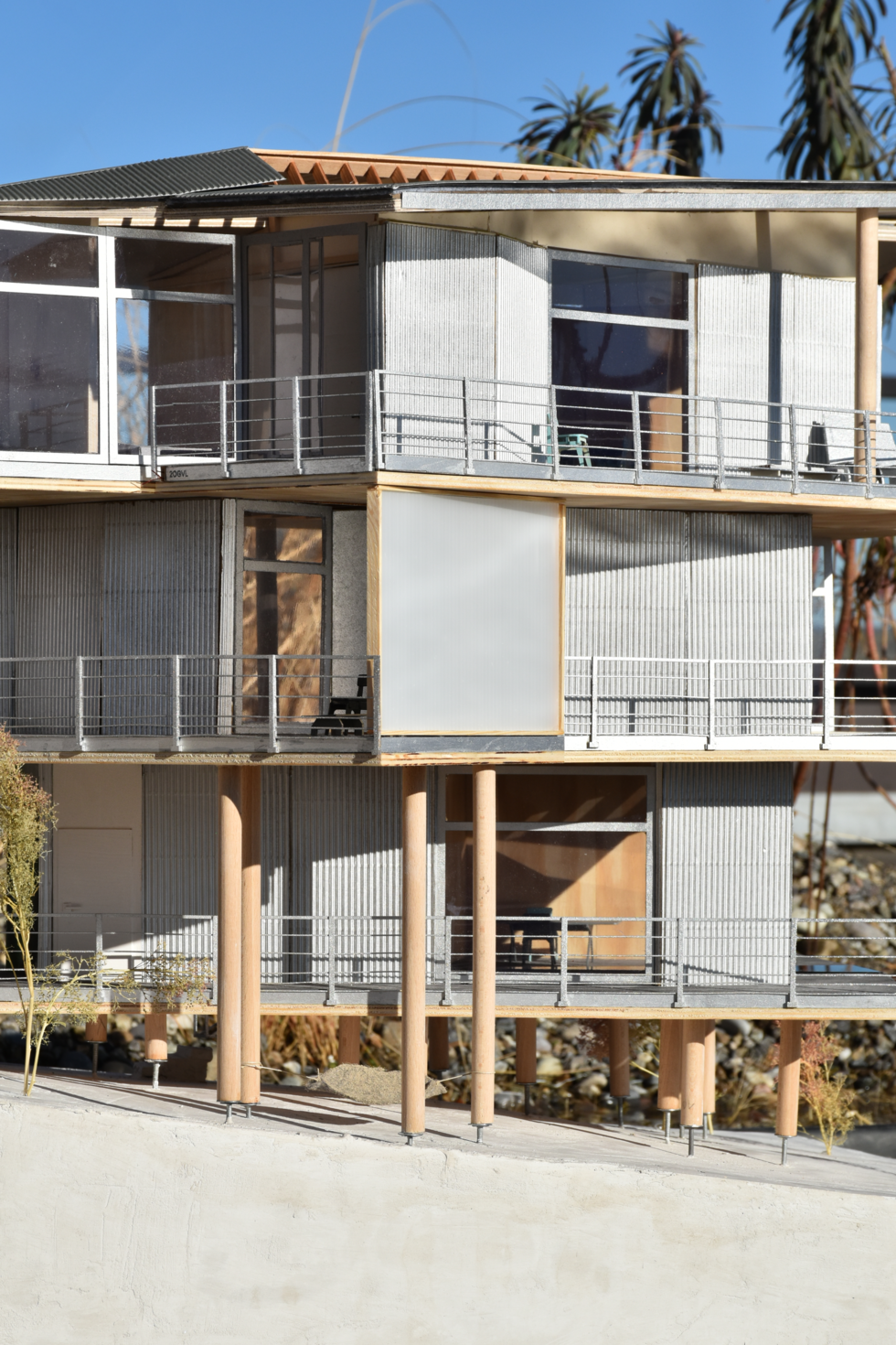 Algorithmic architectural model featuring modular wood construction that creates primitive, informal spaces, demonstrating innovative design approaches for flexible living.