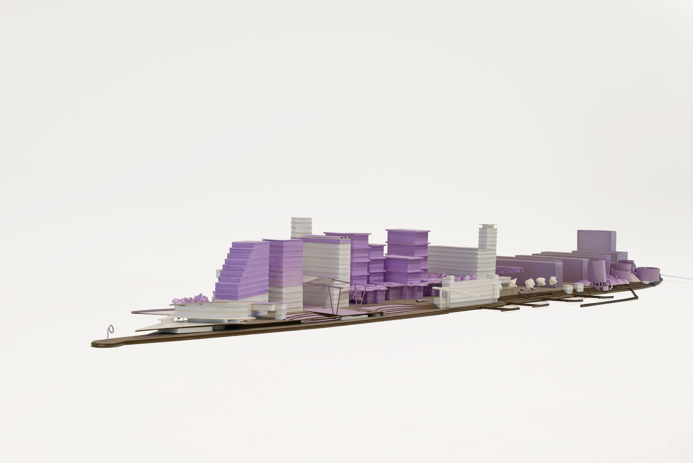 Architectural rendering of a modern, multi-story building facade featuring large, irregularly placed rectangular windows and a mix of light and dark materials, set against a blue sky, showcasing contemporary design.