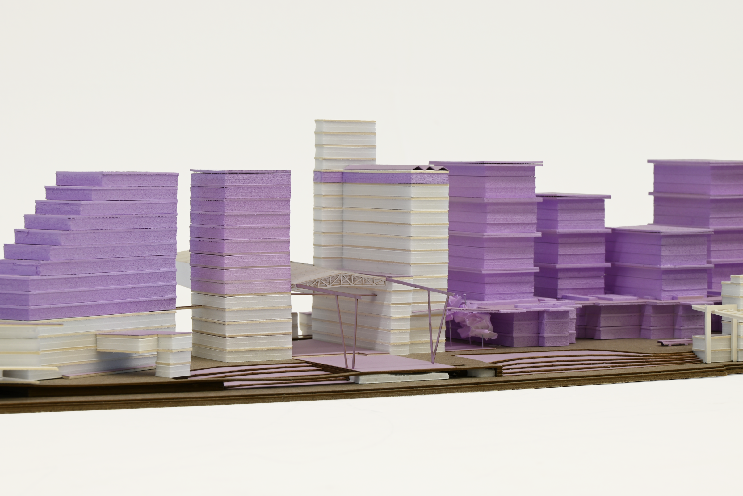 Architectural rendering of a large, open public space with a high ceiling, featuring exposed concrete elements and circular light fixtures, designed for flexible use or events.
