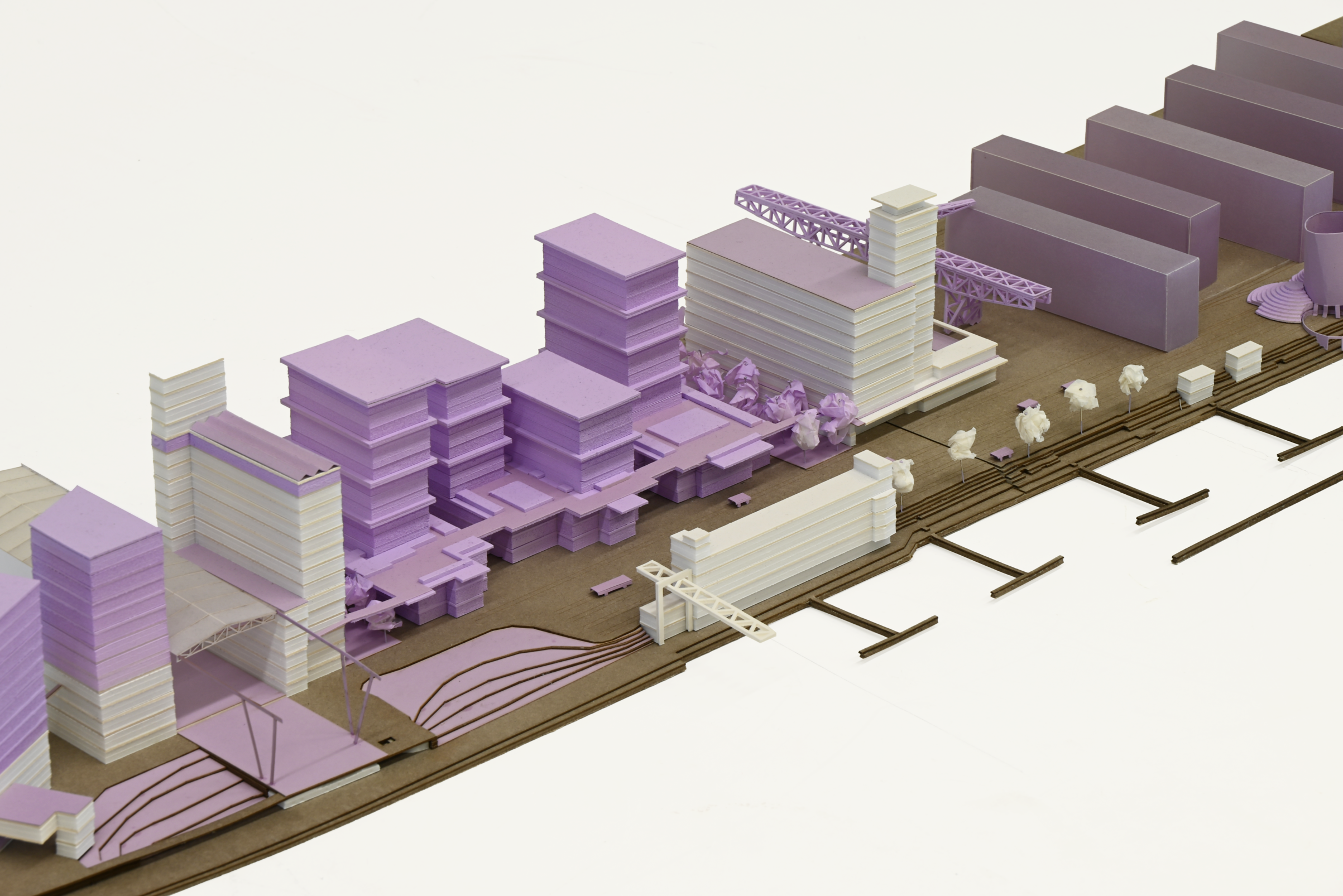 Architectural model constructed from foam, cardboard, and paper, showcasing the proposed site plan and massing of buildings within the Westquai urban development.