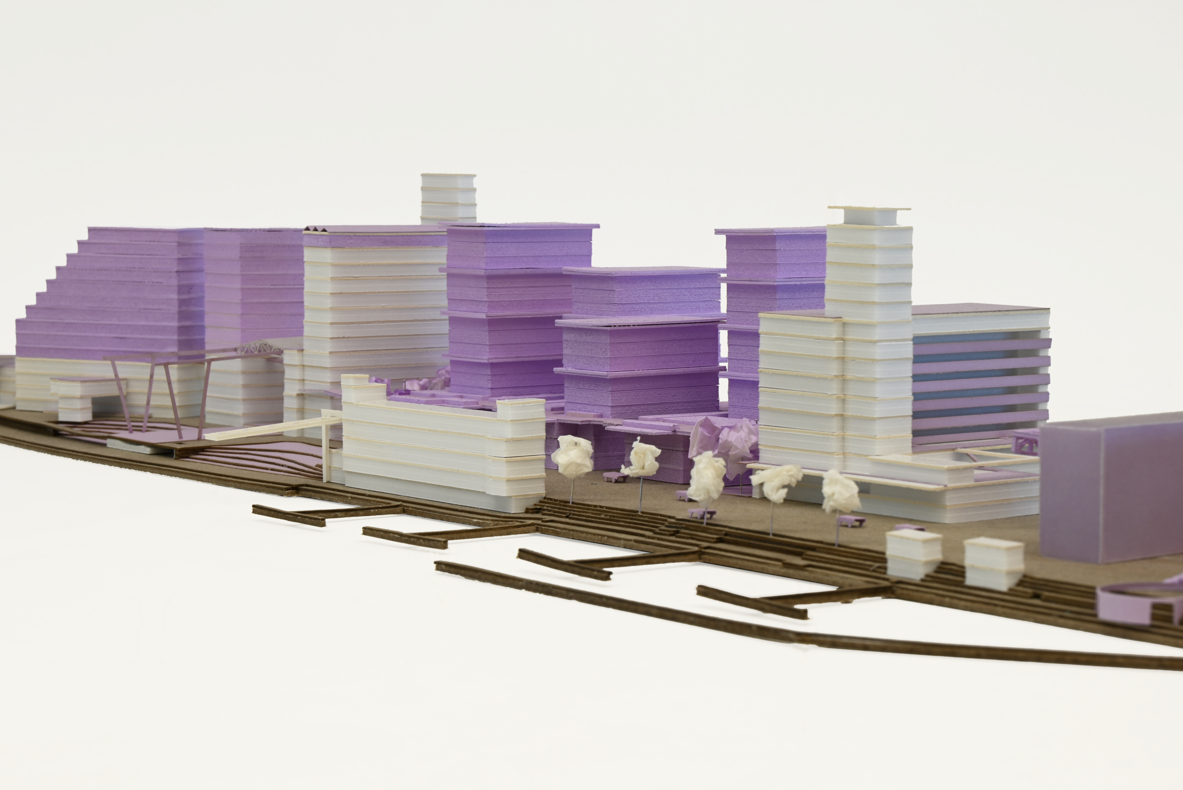 Architectural model depicting a new housing development with multiple residential units, illustrating the layout and form of the proposed homes.